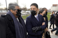 Actor Jussie Smollett looks back at his mother as they arrive with other family members Monday, Nov. 29, 2021, at the Leighton Criminal Courthouse for jury selection at his trial in Chicago. Smollett is accused of lying to police when he reported he was the victim of a racist, anti-gay attack in downtown Chicago nearly three years ago, in Chicago. (AP Photo/Charles Rex Arbogast)