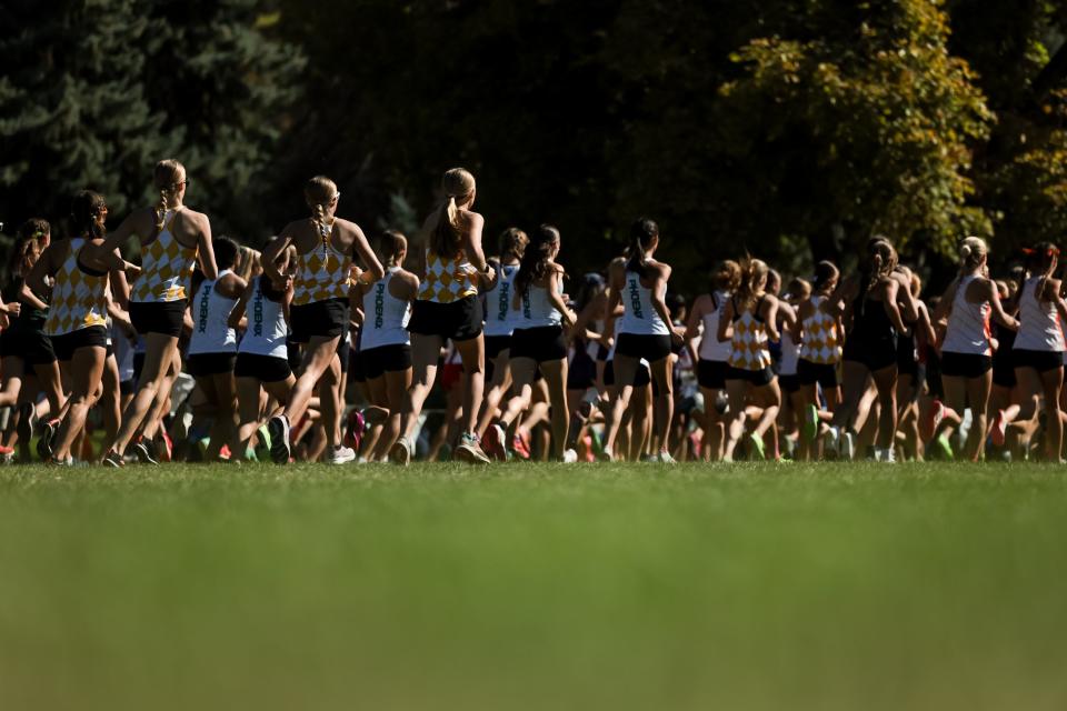 Racers compete in the championship girls race at the Border Wars XC meet at Sugar House Park in Salt Lake City on Saturday, Sept. 16, 2023. | Spenser Heaps, Deseret News