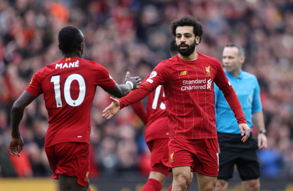 First-half goals by Mohamed Salah (right) and Sadio Mane sent Liverpool on its way after a slow start. (Reuters/Carl Recine)