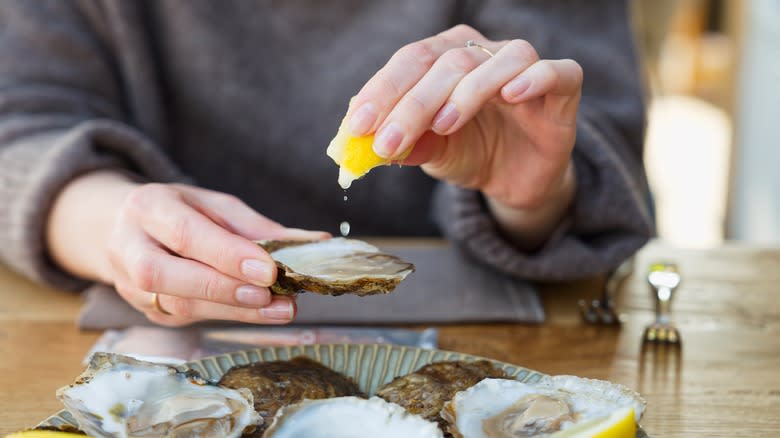 Women enjoying raw oysters