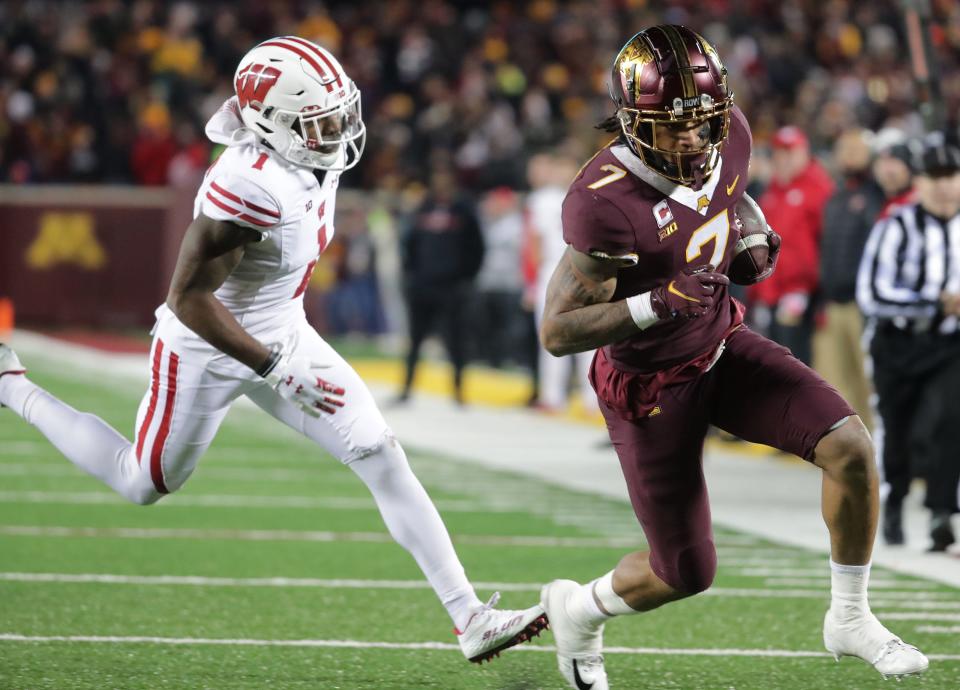 Minnesota wide receiver Chris Autman-Bell outraces Wisconsin cornerback Faion Hicks to score the go-ahead touchdown during the third quarter Saturday.