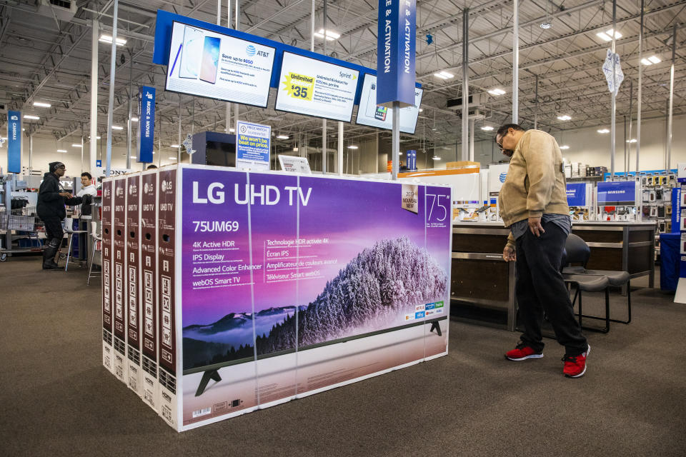 EMERYVILLE, CA - NOVEMBER 29: A Black Friday shopper looks at a television at a Best Buy store on November 29, 2019 in Emeryville, United States. Black Friday is traditionally the biggest shopping event of the year, and marks the beginning of the holiday shopping season. (Photo by Philip Pacheco/Getty Images)