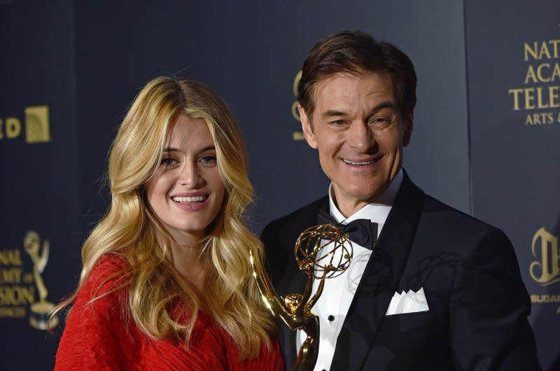 Daphne Oz, seen with her father Dr. Mehmet Oz, returns for "Masterchef Junior." File Photo by Christine Chew/UPI
