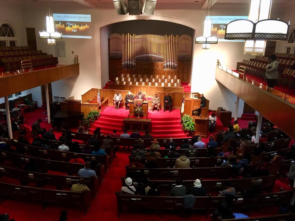 A crowd gathers at 16th Street Baptist Church in Birmingham, Ala., Tuesday, Nov. 27, 2018, for a community vigil regarding the shooting death of Emantic "EJ" Bradford Jr., a black man by police in a shopping mall on Thanksgiving. Bradford's mother said Tuesday that she believes her son would still be alive had he been white. (AP Photo/Jay Reeves)