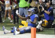 <p>Detroit Lions wide receiver Marvin Jones (11), defended by Green Bay Packers strong safety Kentrell Brice (29), calls for teammates after catching a pass for a touchdown during the first half of an NFL football game, Sunday, Dec. 31, 2017, in Detroit. (AP Photo/Jose Juarez) </p>