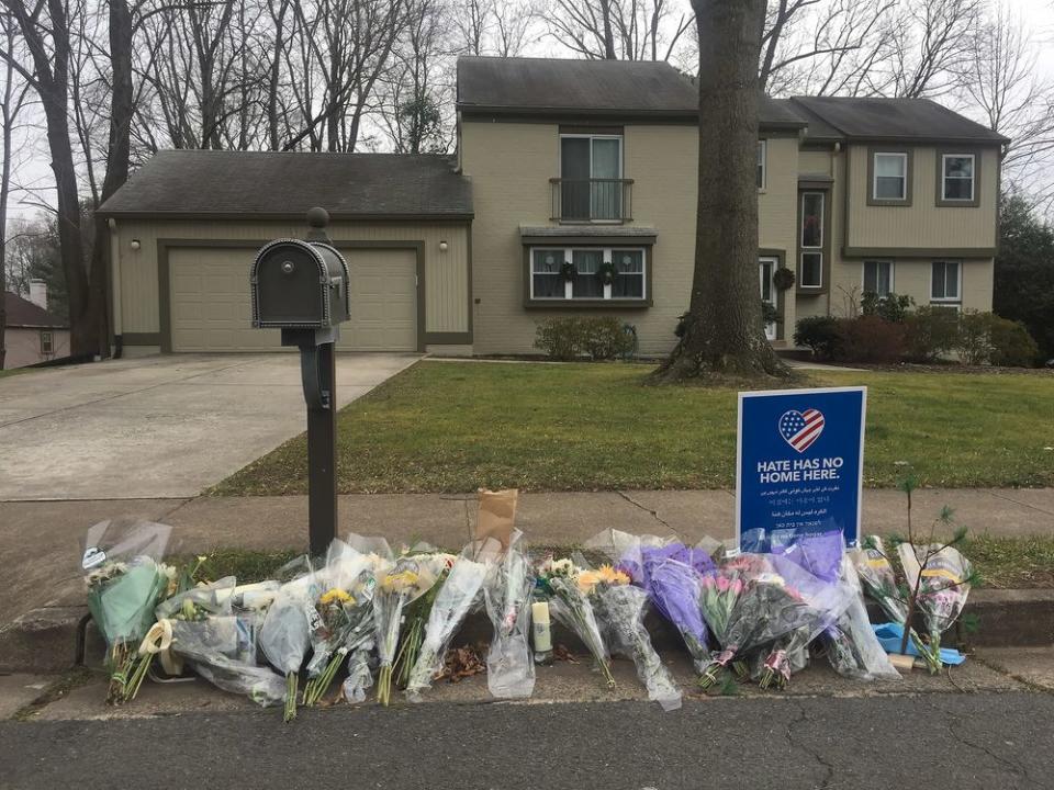 A memorial outside the Reston, Virginia, home of Buckley Kuhn-Fricker and Scott Fircker