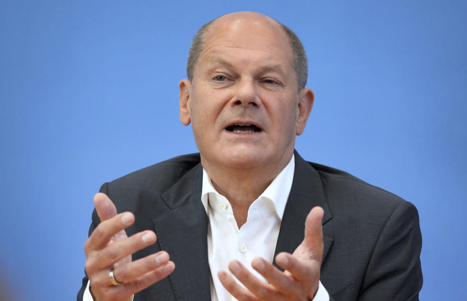 German Chancellor Olaf Scholz addresses the media during his first annual summer news conference in Berlin, Germany, Thursday, Aug. 11, 2022. (AP Photo/Michael Sohn)