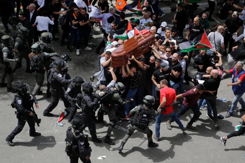 Israeli police clash with mourners as they carry the coffin of slain Al Jazeera journalist Shireen Abu Akleh during her funeral in east Jerusalem, on May 13, 2022. Abu Akleh, a Palestinian-American reporter who covered the Mideast conflict for more than 25 years, was shot dead two days earlier during an Israeli military raid in the West Bank town of Jenin. Photographer Maya Levin, for the Associated Pres, won the Asia Singles Category of the World Press Photo Contest, announced Thursday, April 20, 2023.