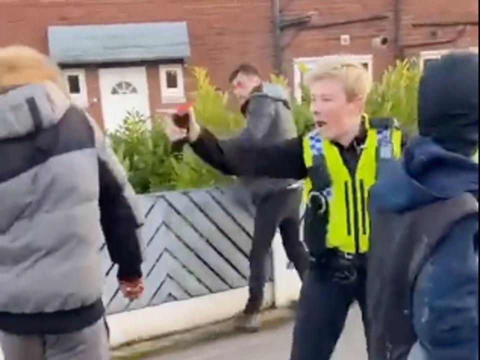 A West Yorkshire Police officer was filmed deploying irritant spray on members of the public (X/London & UK Street News)