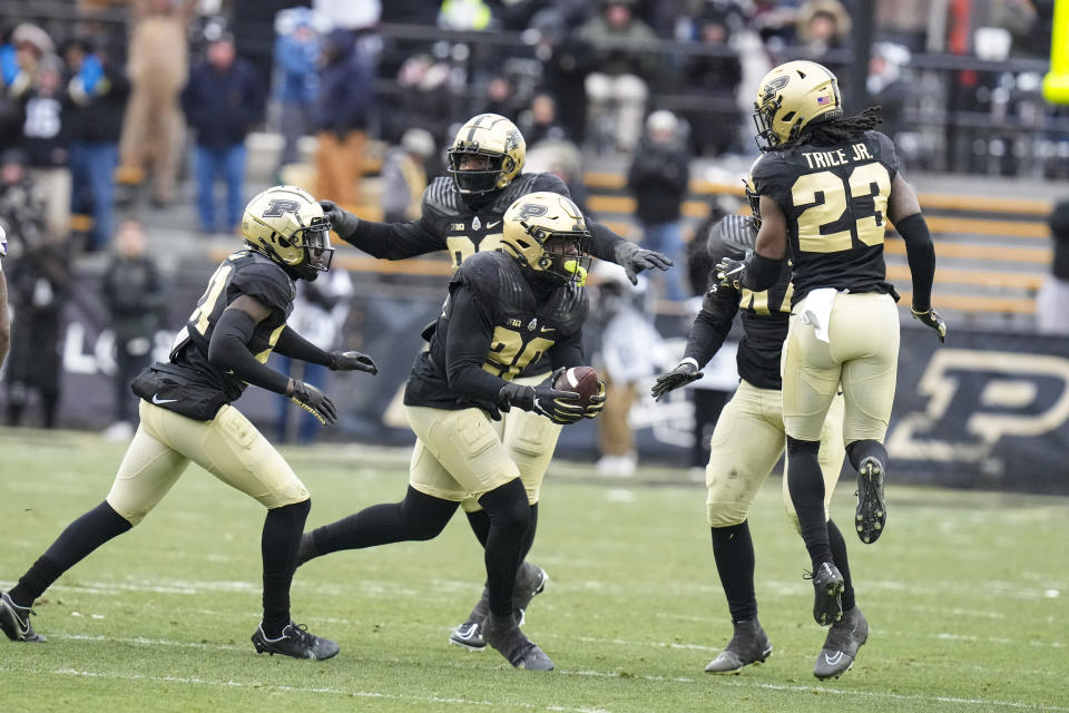 Purdue linebacker OC Brothers (20) celebrates a fumble recovery against Northwestern during the second half of an NCAA college football game in West Lafayette, Ind., Saturday, Nov. 19, 2022. Purdue defeated Northwestern 17-9. (AP Photo/Michael Conroy)