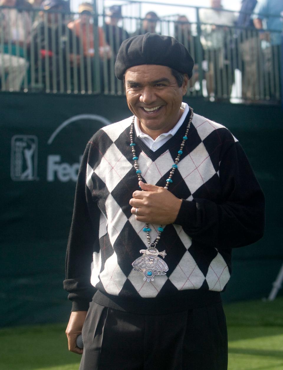 Comedian George Lopez wears a necklace given to him by a member of the Thunderbirds during the FBR/Xerox Silver Pro-Am on Jan. 30, 2008.
