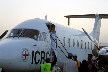 Saudi prisoner Moussa Awaji gestures as he boards an ICRC plane at the Sanaa airport after he was released by the Houthis in Sanaa, Yemen January 29, 2019. REUTERS/Khaled Abdullah