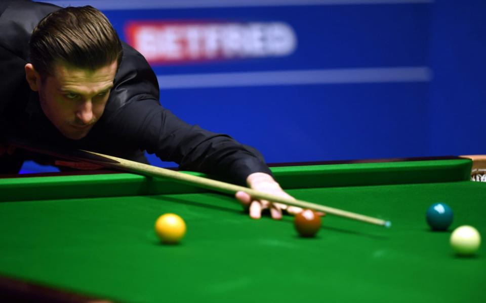 Selby made a break of 131 in the 32nd frame to move within one of the title - Credit: PAUL ELLIS/AFP