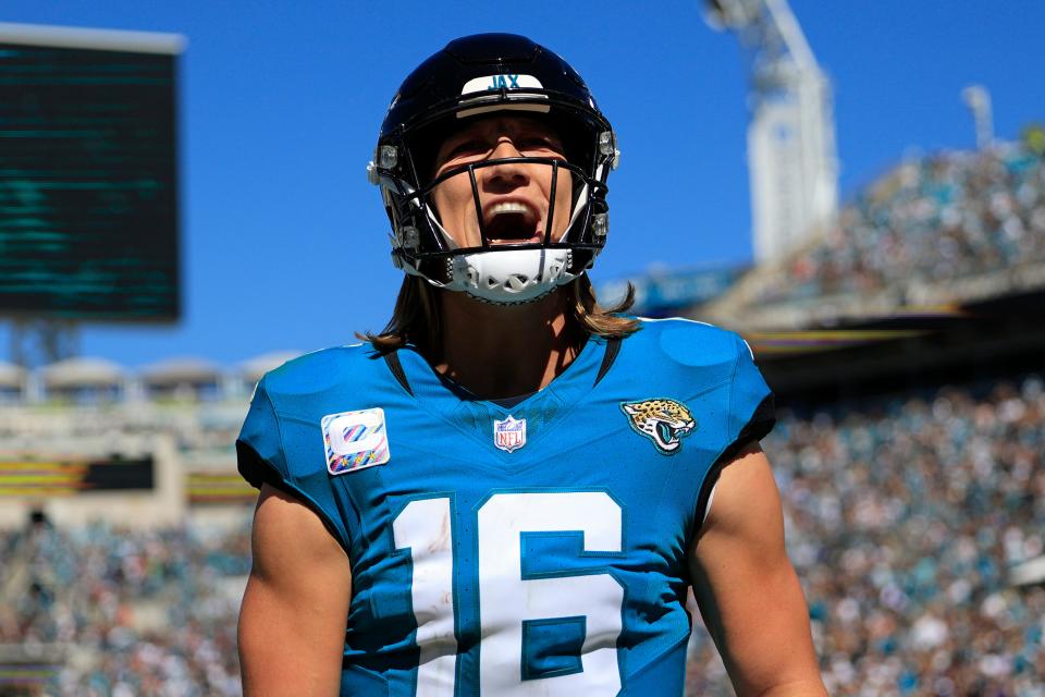 Jacksonville Jaguars quarterback Trevor Lawrence (16) yells after wide receiver <a class="link " href="https://sports.yahoo.com/nfl/players/31017" data-i13n="sec:content-canvas;subsec:anchor_text;elm:context_link" data-ylk="slk:Christian Kirk;sec:content-canvas;subsec:anchor_text;elm:context_link;itc:0">Christian Kirk</a> (13), not shown, caught a pass for a touchdown score during the second quarter of an NFL football matchup Sunday, Oct. 15, 2023 at EverBank Stadium in Jacksonville, Fla. The Jacksonville Jaguars defeated the Indianapolis Colts 37-20. Corey Perrine/Florida Times-Union / USA TODAY NETWORK