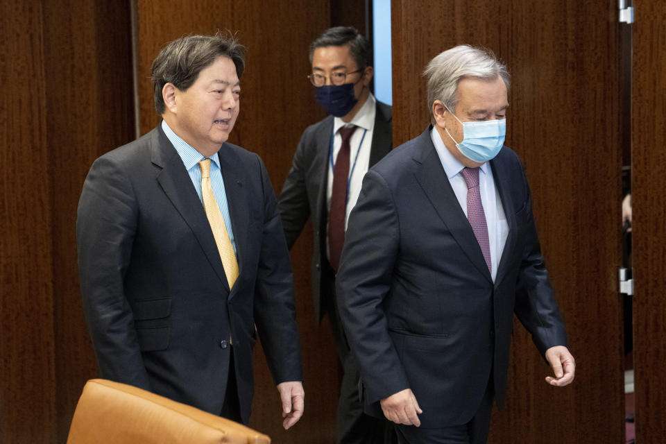 Hayashi Yoshimasa, Minister for Foreign Affairs of Japan, left, meets with United Nations Secretary General Antonio Guterres at United Nations headquarters, Thursday, Jan. 12, 2023. (AP Photo/John Minchillo)