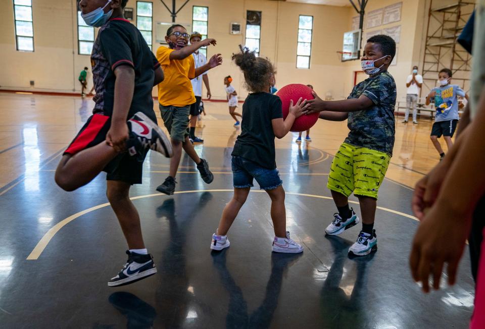Students play kickball in the gym during Detroit Magic Child Development Summer Enrichment Madness in Detroit on July 14, 2022. The organization is one of fifteen in Michigan accepted into phase two of "A Community Thrives" grant program by Gannett.