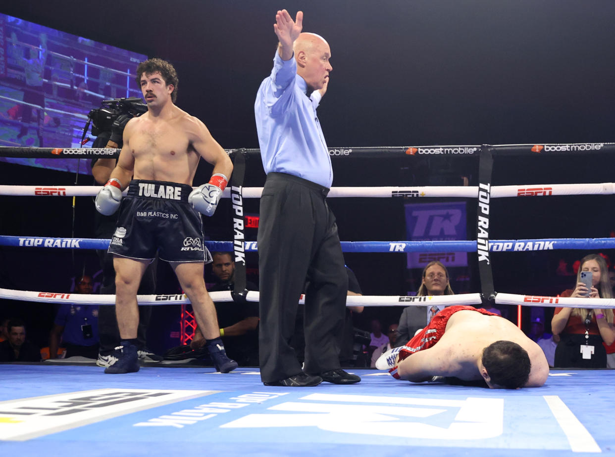 CATOOSA, OKLAHOMA - AUGUST 27: Richard Torrez Jr (L) knocks-down Marco Antonio Canedo (R) during their heavyweight fight at Hard Rock Hotel & Casino Tulsa on August 27, 2022 in Catoosa, Oklahoma. (Photo by Mikey Williams/Top Rank Inc via Getty Images)