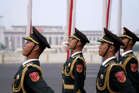 Members of honour guards attend a welcoming ceremony for Tajikistan's President Emomali Rahmon outside the Great Hall of the People in Beijing, China August 31, 2017. REUTERS/Jason Lee