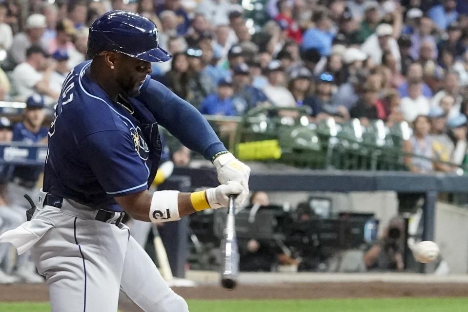 Tampa Bay Rays' Yandy Diaz hits a two-run home run during the third inning of a baseball game against the Milwaukee Brewers Tuesday, Aug. 9, 2022, in Milwaukee. (AP Photo/Morry Gash)