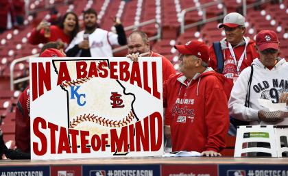St. Louis Cardinals fan Marty Prather holds up a sign before game one of the NLCS. (USAT)