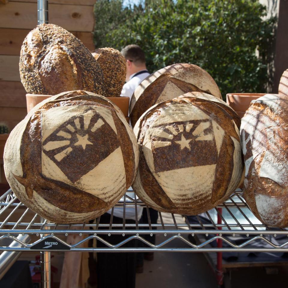 Barrio Bread loaves featuring an encrusted Arizona flag.