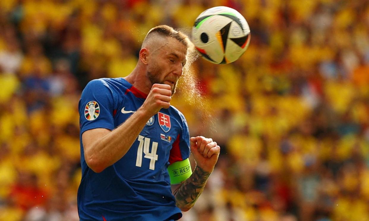 <span>Slovakia captain Milan Skriniar in action against Romania, where a 1-1 draw helped his team finish third in Group E.</span><span>Photograph: Kai Pfaffenbach/Reuters</span>