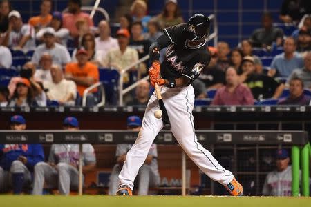 Sep 26, 2016; Miami, FL, USA; Miami Marlins second baseman Dee Gordon connects for his fourth hit of the game against the New York Mets at Marlins Park. Mandatory Credit: Jasen Vinlove-USA TODAY Sports