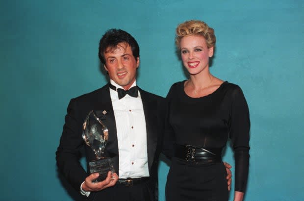 Sylvester Stallone and his wife Brigitte Nielsen are all smiles as he displays his People's Choice award.<p><a href="https://www.gettyimages.com/detail/515169318" rel="nofollow noopener" target="_blank" data-ylk="slk:Bettmann/Getty Images;elm:context_link;itc:0;sec:content-canvas" class="link ">Bettmann/Getty Images</a></p>