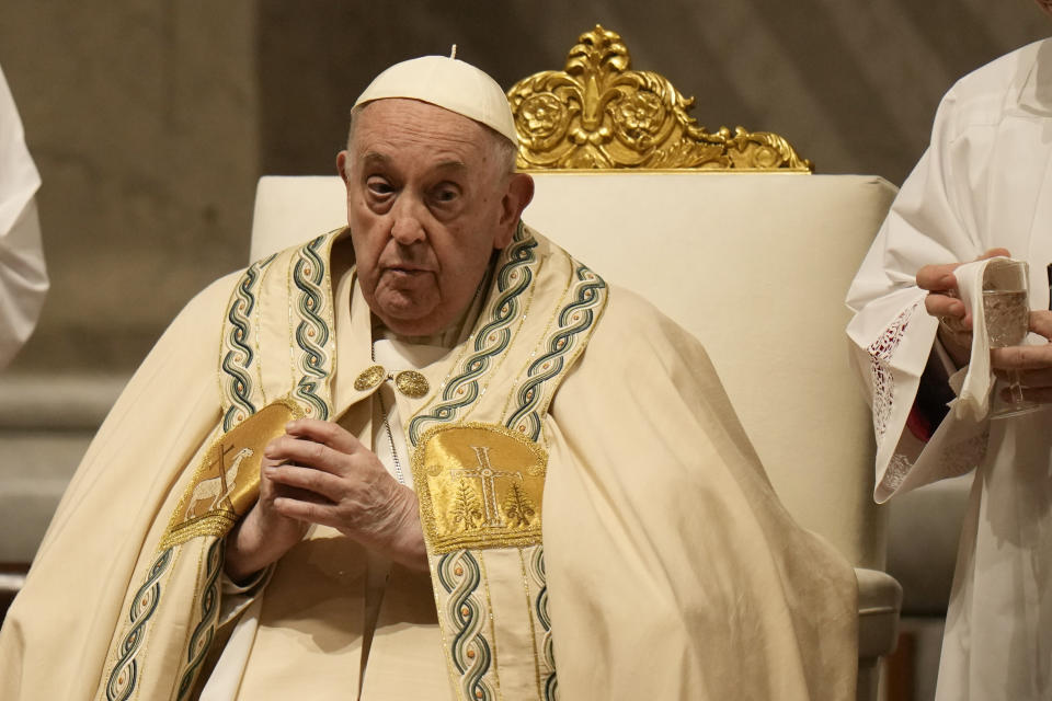 Pope Francis presides over the Easter vigil celebration in St. Peter's Basilica at the Vatican, Saturday, March 30, 2024. (AP Photo/Alessandra Tarantino)