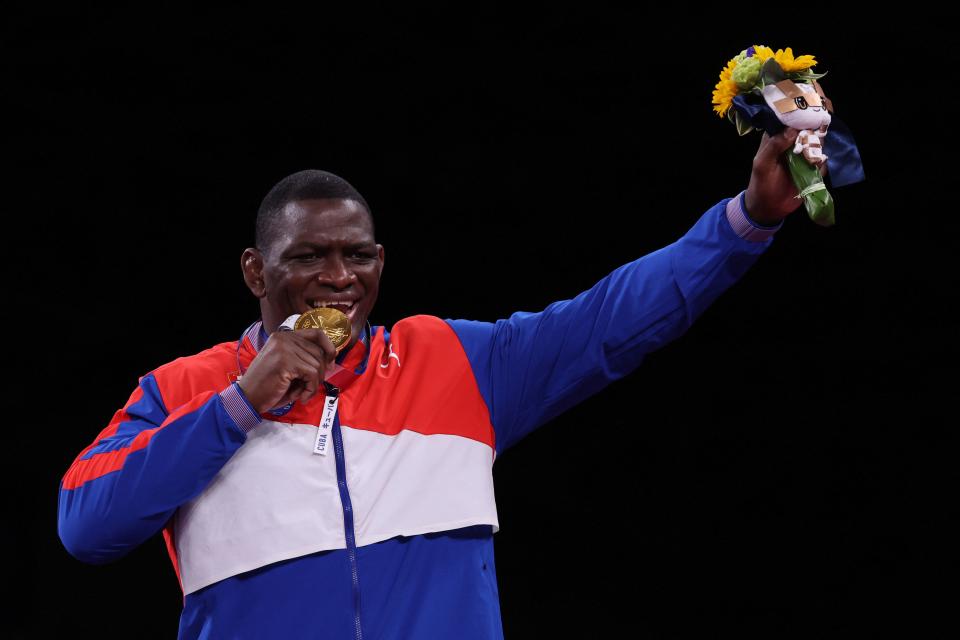 Gold medalist Cuba's Mijain Lopez Nunez poses on the podium after the men's greco-roman 130kg wrestling competition of the Tokyo 2020 Olympic Games at the Makuhari Messe in Tokyo on August 2, 2021. (Photo by Jack GUEZ / AFP) (Photo by JACK GUEZ/AFP via Getty Images)
