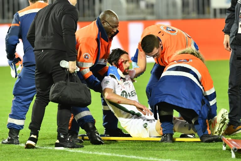 Saint-Etienne's Serbian was stretchered off after at Bordeaux after colliding with his own goalkeeper Stephane Ruffier