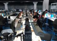 Employees work at a diamond-cutting factory in Abovyan