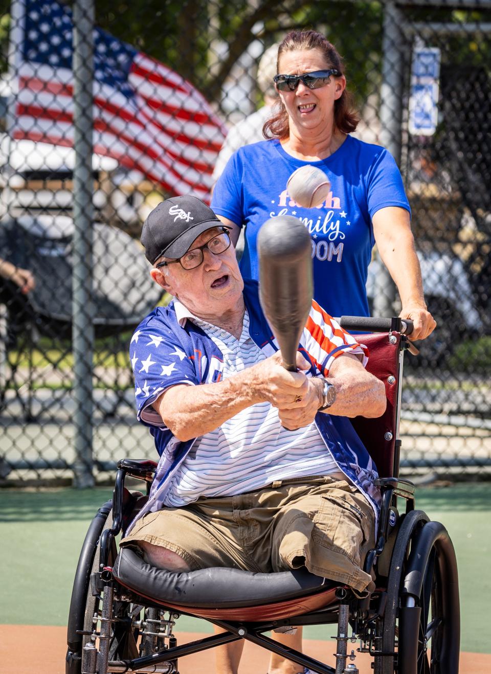 Air Force veteran Ted Turza makes contact for a base hit as residents of the Clifford Sims State Veterans Nursing Home play baseball at Frank Brown Park's Miracle Field on Tuesday.