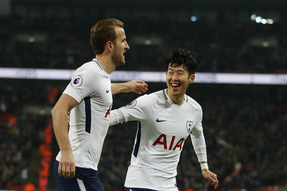 Tottenham duo Harry Kane and Heung-Min Son celebrate one of Kane’s two goals against Everton. (Getty)