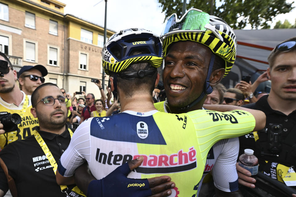Stage winner Eritrea's Biniam Girmay celebrates with a teammate after during the third stage of the Tour de France cycling race over 230.8 kilometers (143.4 miles) with start in Plaisance and finish in Turin, Italy, Monday, July 1, 2024. (Tim de Waele/Pool Photo via AP)