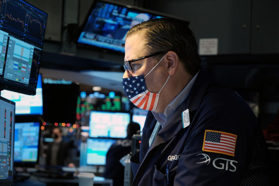 Traders work on the floor of the New York Stock Exchange (NYSE) on the first day of trading in the new year on January 03, 2022 in New York City. (Photo by Spencer Platt/Getty Images)