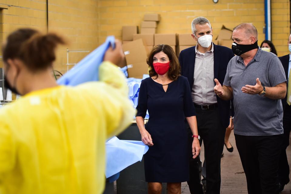From left center, Lt. Governor Kathy Hochul and Congressman Anthony Brindisi talk with Al Zennamo while taking a tour through Genesis Disposables LLC on Thursday, July 16, 2020 in Frankfort, NY.
