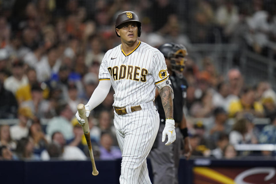 San Diego Padres' Manny Machado reacts after striking out with the bases loaded during the fifth inning of a baseball game against the San Francisco Giants, Wednesday, Sept. 22, 2021, in San Diego. (AP Photo/Gregory Bull)