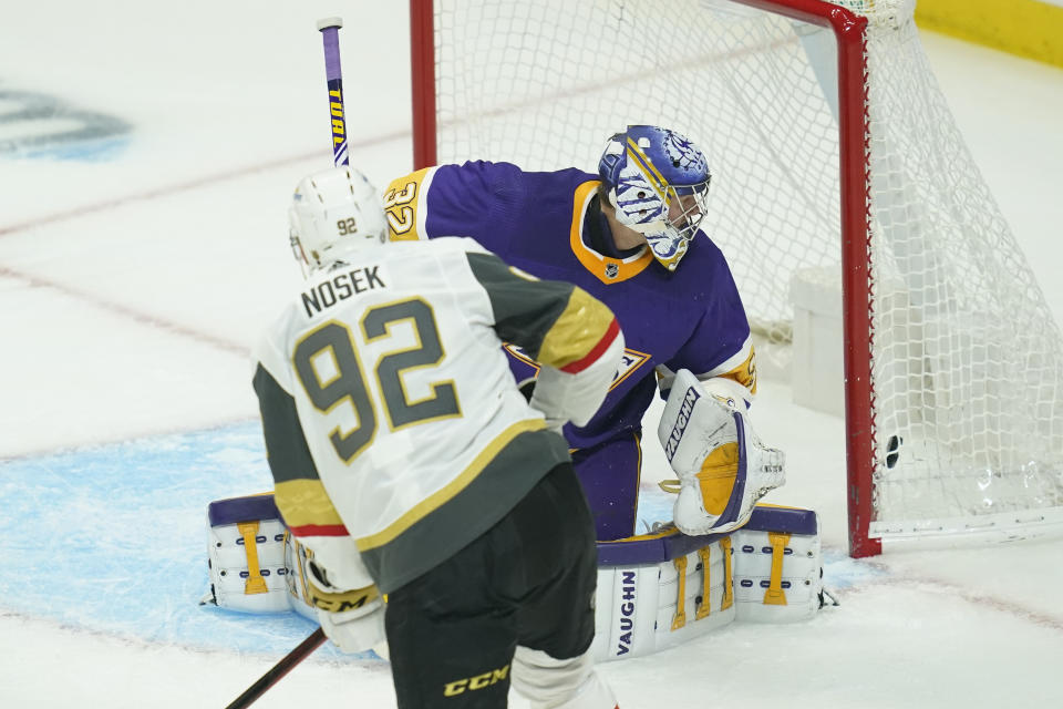 Vegas Golden Knights left wing Tomas Nosek (92) scores a goal against Los Angeles Kings goaltender Jonathan Quick (32) during the first period of an NHL hockey game Wednesday, April 14, 2021, in Los Angeles. (AP Photo/Ashley Landis)