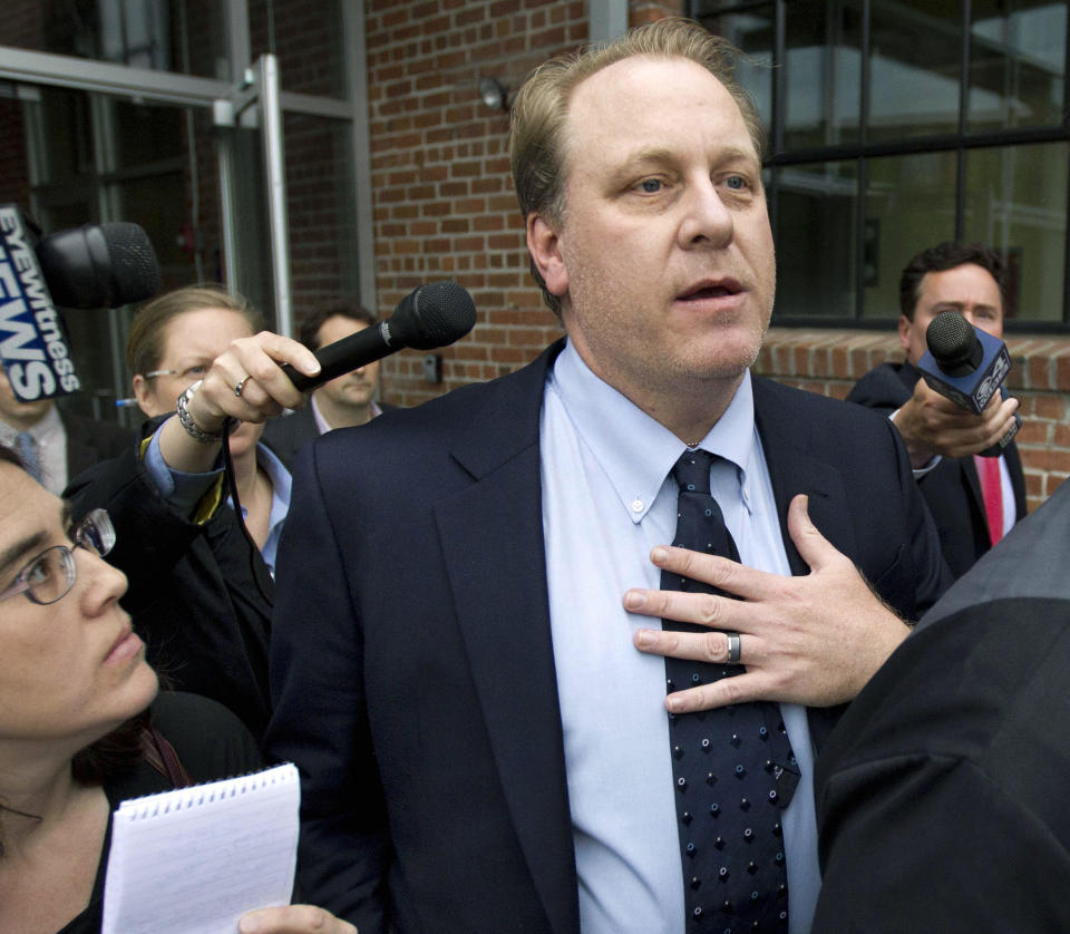 May 16, 2012 file photo shows former Boston Red Sox pitcher Curt Schilling followed by members of the media as he departs the Rhode Island Economic Development Corporation headquarters, in Providence, R.I.  / Credit: Steven Senne / AP