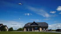 Residents receive a drone home delivery in the village of Moneygall