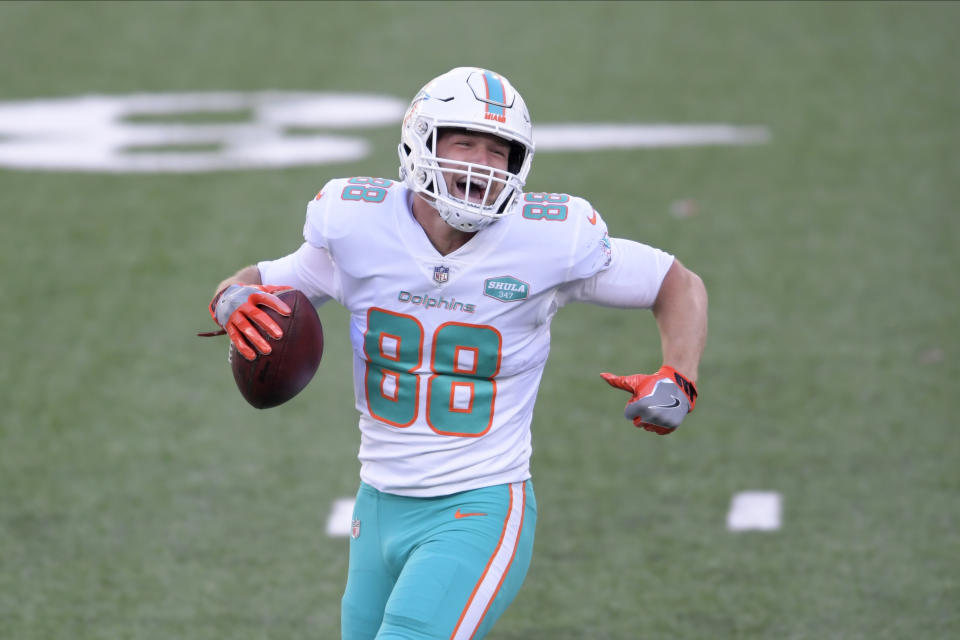 Miami Dolphins' Mike Gesicki celebrates his touchdown during the first half of an NFL football game against the New York Jets, Sunday, Nov. 29, 2020, in East Rutherford, N.J. (AP Photo/Bill Kostroun)