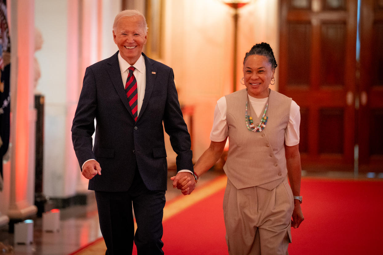 WASHINGTON, DC - SEPTEMBER 10: U.S. President Joe Biden and South Carolina Gamecocks Head Coach Dawn Staley arrive for a celebration of the 2023-2024 University of South Carolina Gamecocks Women's Basketball NCAA championship team in the East Room at the White House on September 10, 2024 in Washington, DC. The Gamecocks ended their season undefeated and beat the Iowa Hawkeyes 87-75 for their third NCAA Championship with Head Coach Dawn Staley. (Photo by Andrew Harnik/Getty Images)