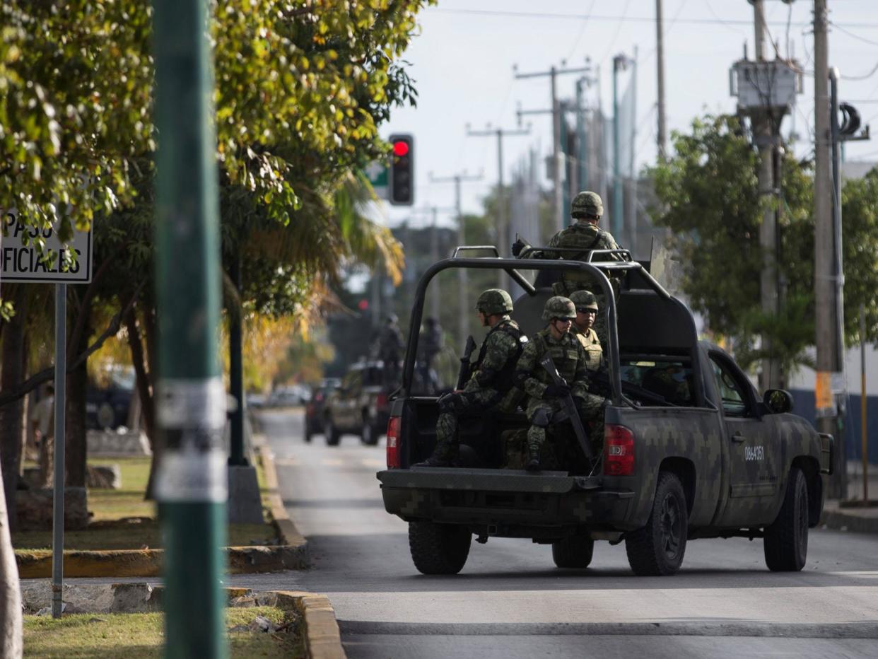 Soldiers are seen in a vehicle near the state attorney general's office after gunmen opened fire: REUTERS