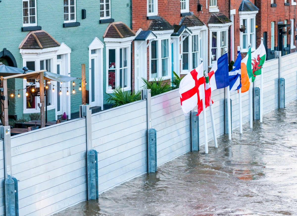 Emergency flood barriers protect homes in Bewdley Bridge, Worcestershire, earlier this year following torrential rain (Getty)