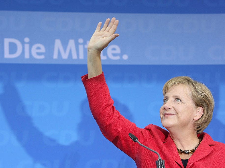 German Chancellor Angela Merkel wave