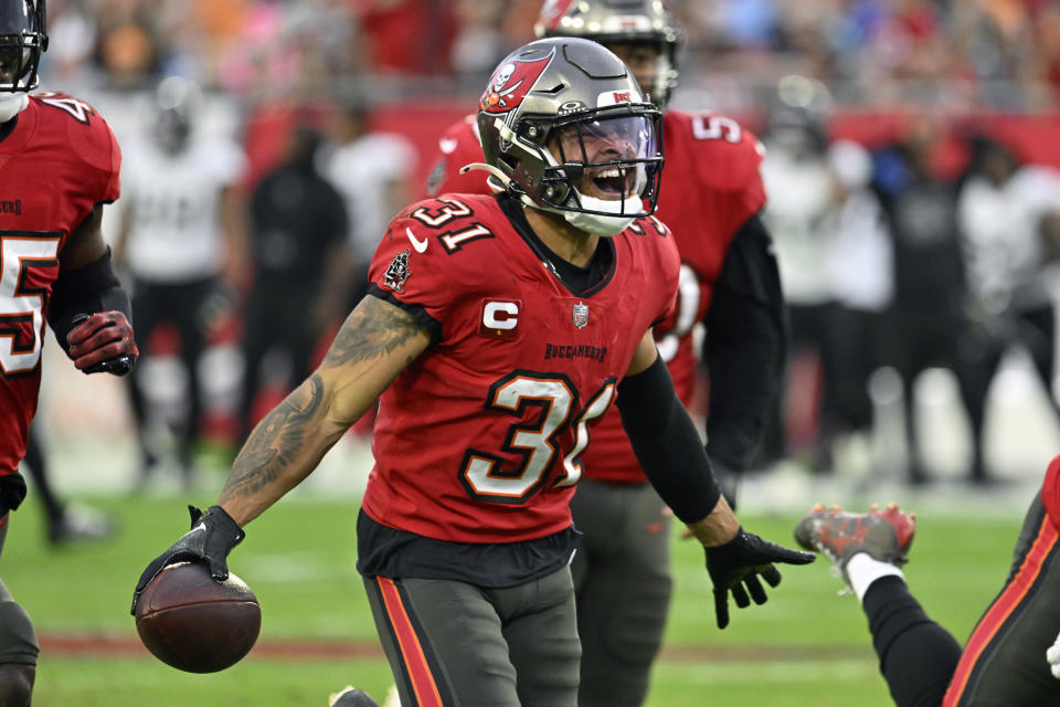 Jacksonville Jaguars cornerback Tyson Campbell (32) breaks up a pass intended for Tampa Bay Buccaneers wide receiver Mike Evans (13) during the first half of an NFL football game Sunday, Dec. 24, 2023, in Tampa, Fla. (AP Photo/Jason Behnken)