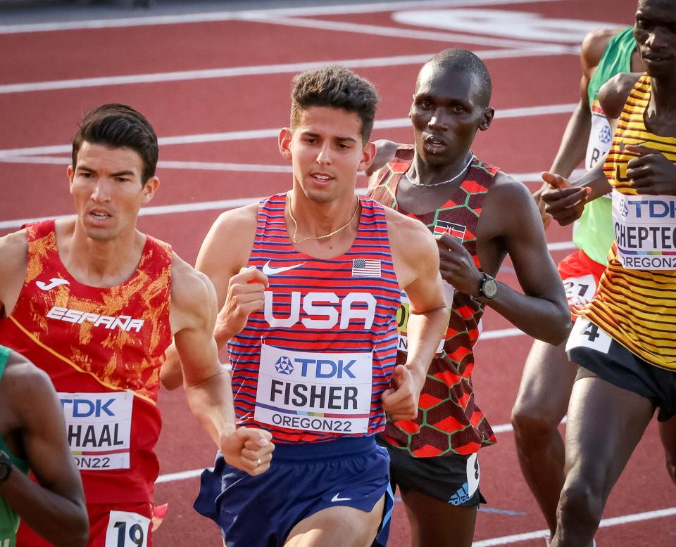 USA's Grant Fisher, center, competes in the first heat of the men's 5,000 meters at the World Athletics Championships on Thursday, July 21, 2021.
