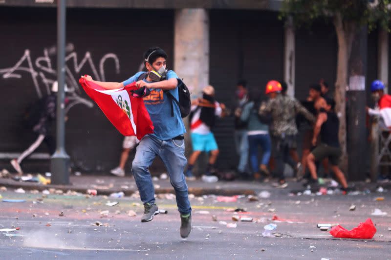 Demonstrators protest to demand Peru's President Boluarte to step down, in Lima