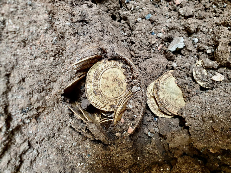 The coins as they were found in the dirt. (Spink and Son)